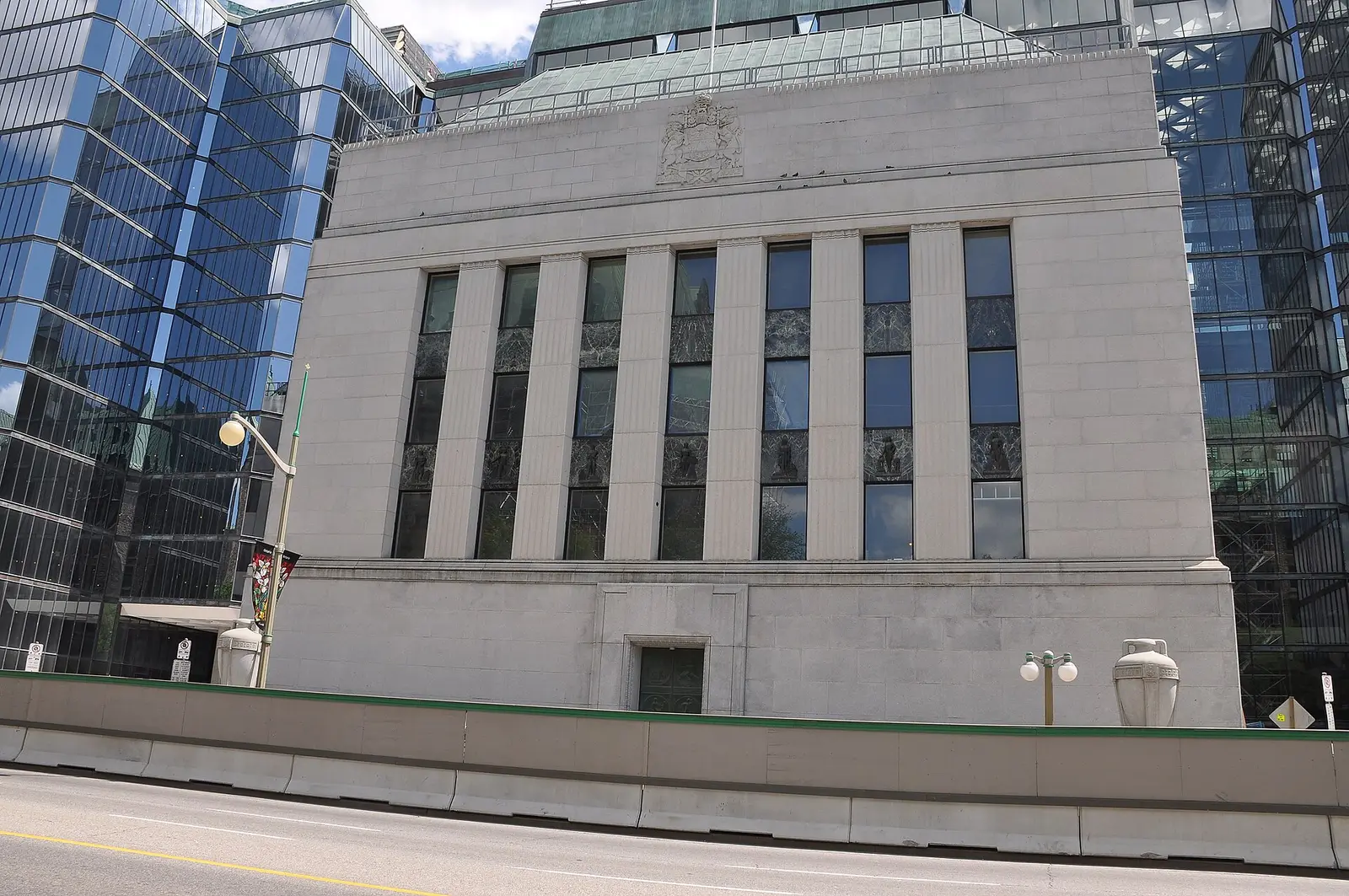 The Bank of Canada headquarters in Ottawa, a stone facade between glass office towers