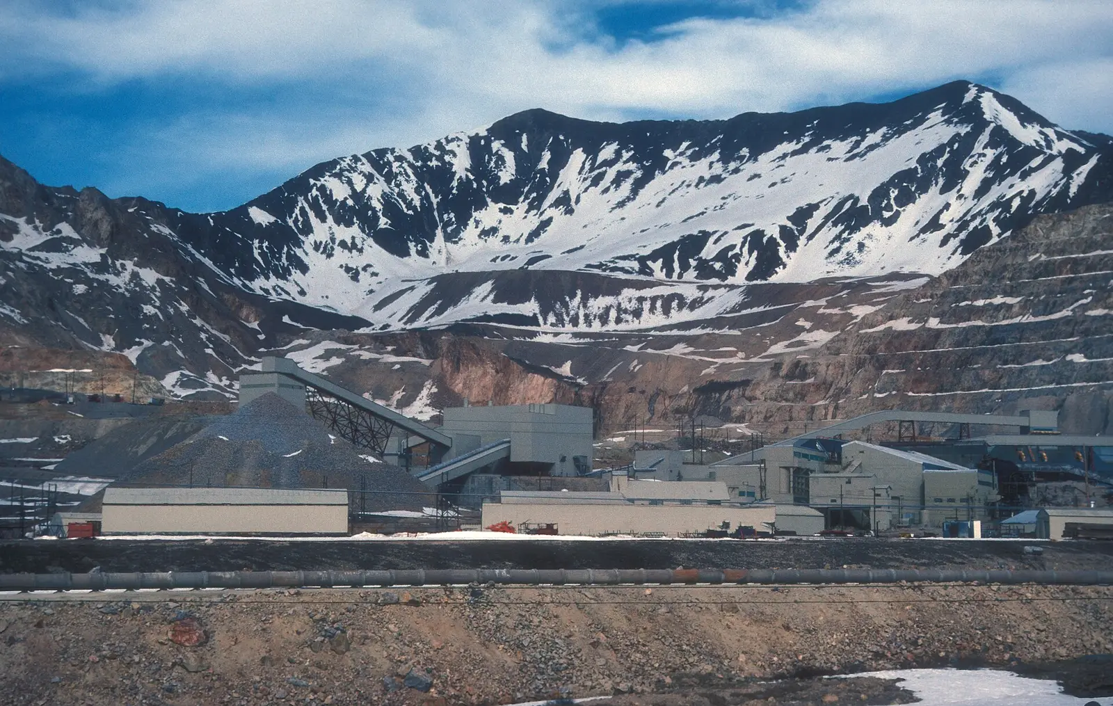 Climax molybdenum mine and mill at Fremont Pass, Colorado, photographed in October 2007, with stockpiled rock and a snow-covered ridge