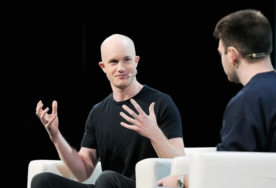 Brian Armstrong, co-founder and chief executive of Coinbase, speaking onstage at a technology conference