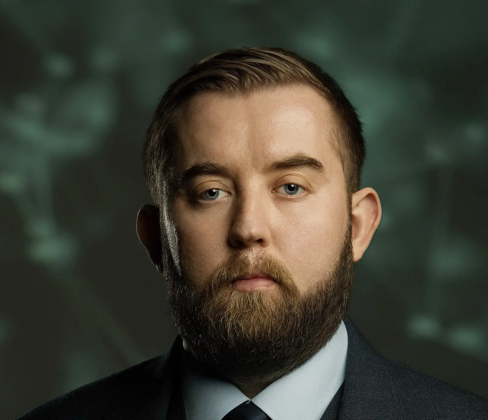 Portrait of Sergey Nazarov, co-founder of Chainlink, wearing a Chainlink hexagon lapel pin