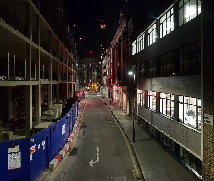 Bonhill Street in London EC2 at night, the City street where Trade Nation Financial UK Ltd has its registered office