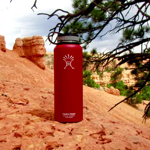 Red Hydro Flask bottle standing on red rock in southern Utah