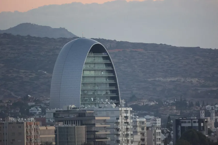 The Oval office tower rising above the Limassol skyline at dusk, Cyprus