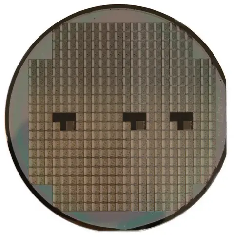 A silicon wafer patterned with rows of integrated-circuit dies