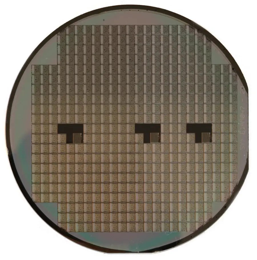 A silicon wafer patterned with rows of integrated-circuit dies