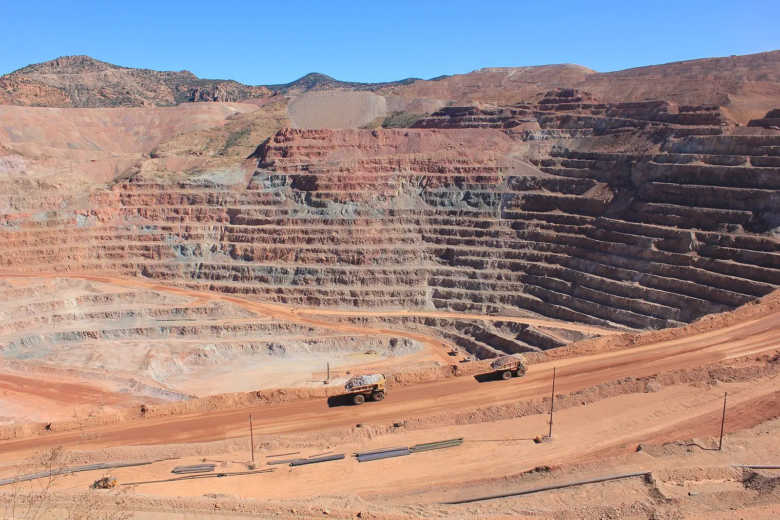 Haul trucks on a bench of the Morenci copper mine in Arizona, operated by Freeport-McMoRan.
