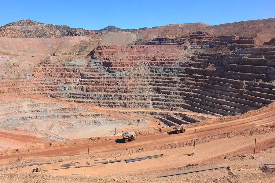 Haul trucks on a bench of the Morenci copper mine in Arizona, operated by Freeport-McMoRan.
