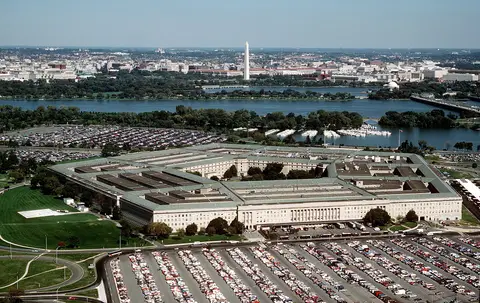 Aerial photograph of the Pentagon in Arlington, Virginia, with the Potomac River and the Washington Monument beyond