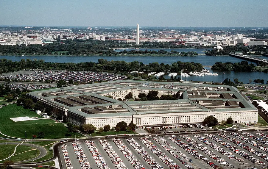 Aerial photograph of the Pentagon in Arlington, Virginia, with the Potomac River and the Washington Monument beyond
