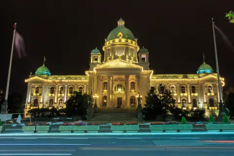 National Assembly of Serbia in Belgrade at night, the building the 25 October 2026 election will fill