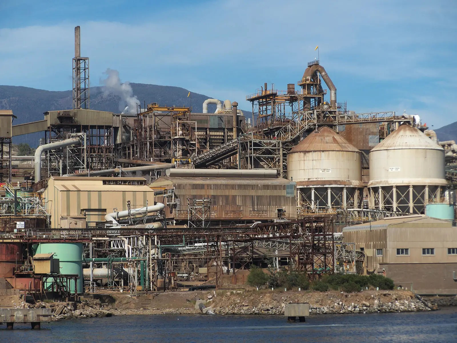 The Nyrstar zinc smelter at Hobart, Tasmania, with its calcine storage silos on the Derwent River