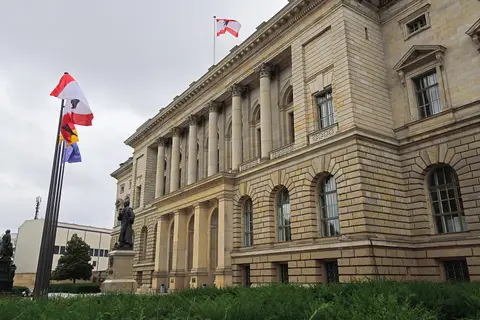 The Abgeordnetenhaus of Berlin, the former Prussian Landtag on Niederkirchnerstrasse, with the Berlin state flag flying above the portico