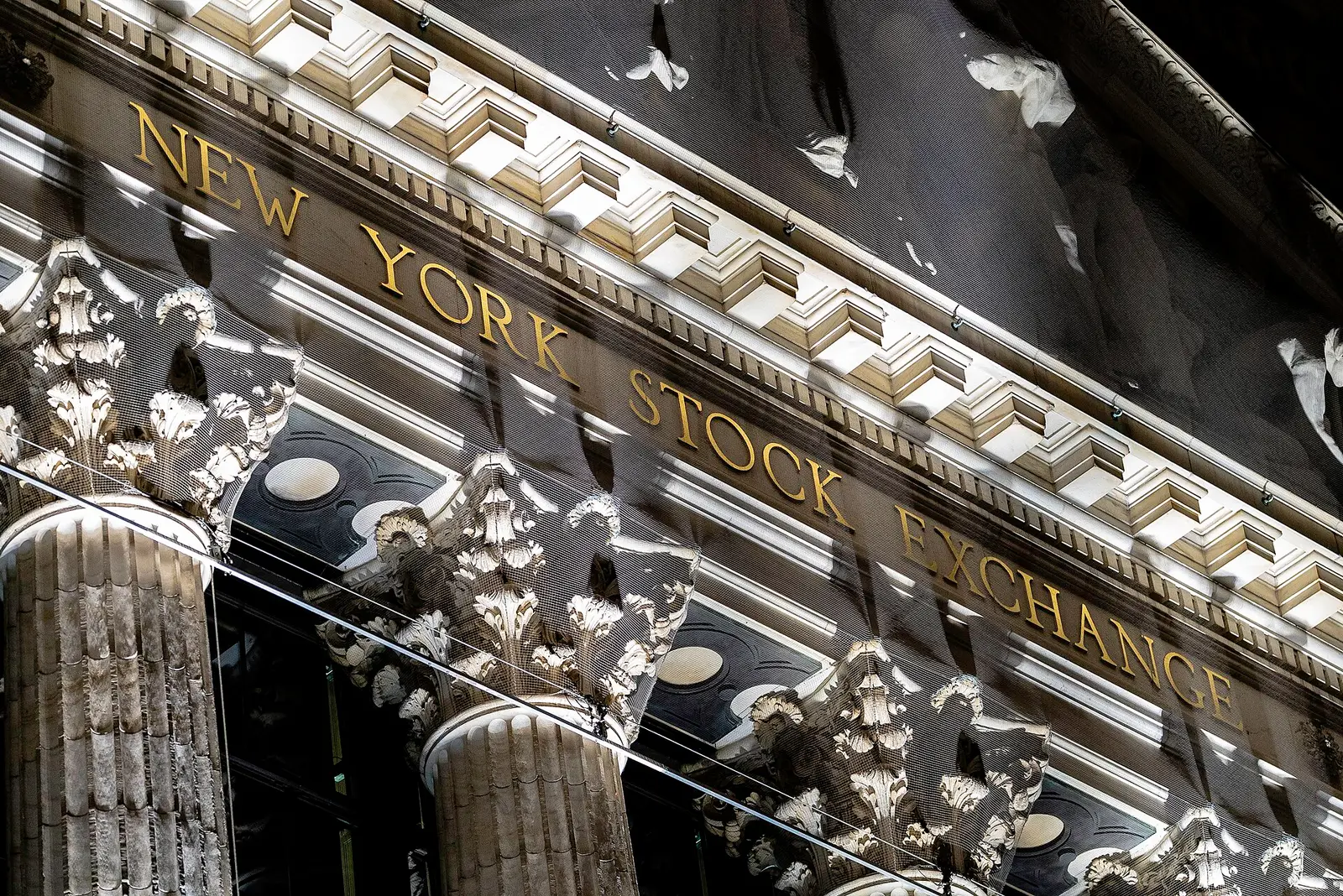 Gilded New York Stock Exchange lettering on the Broad Street facade at night, home of the NYSE Arca listing venue named in the Bitwise NEAR ETF filing