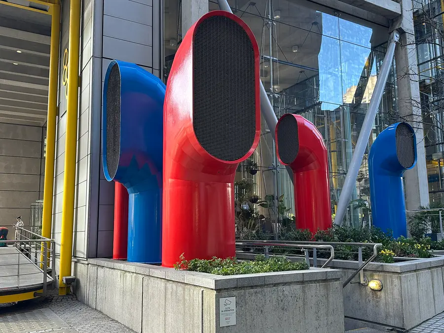 Red and blue ventilation funnels outside 88 Wood Street in the City of London, the registered address of IG Markets Ltd