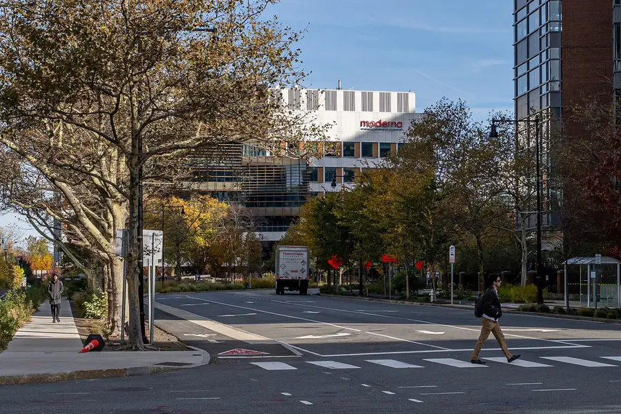 Moderna headquarters on Binney Street in Cambridge Massachusetts seen from a crosswalk in autumn