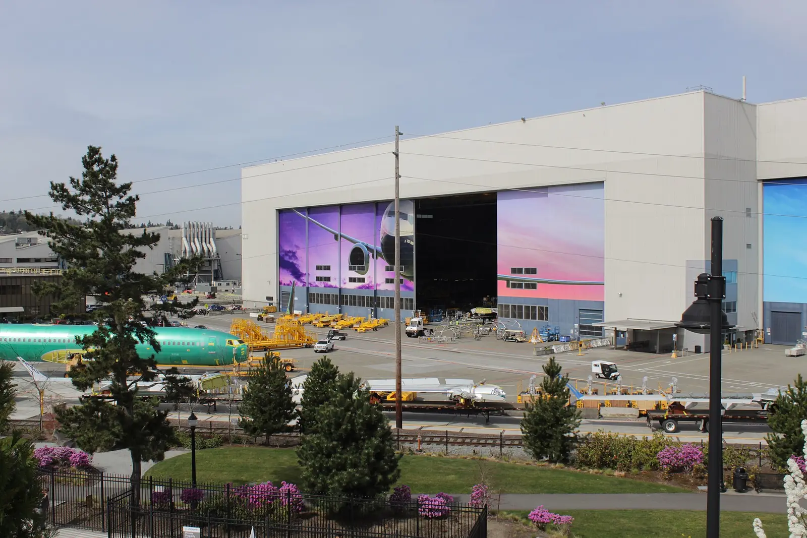 Boeing 737 factory in Renton, Washington, with a 737 fuselage and wing assemblies on the apron