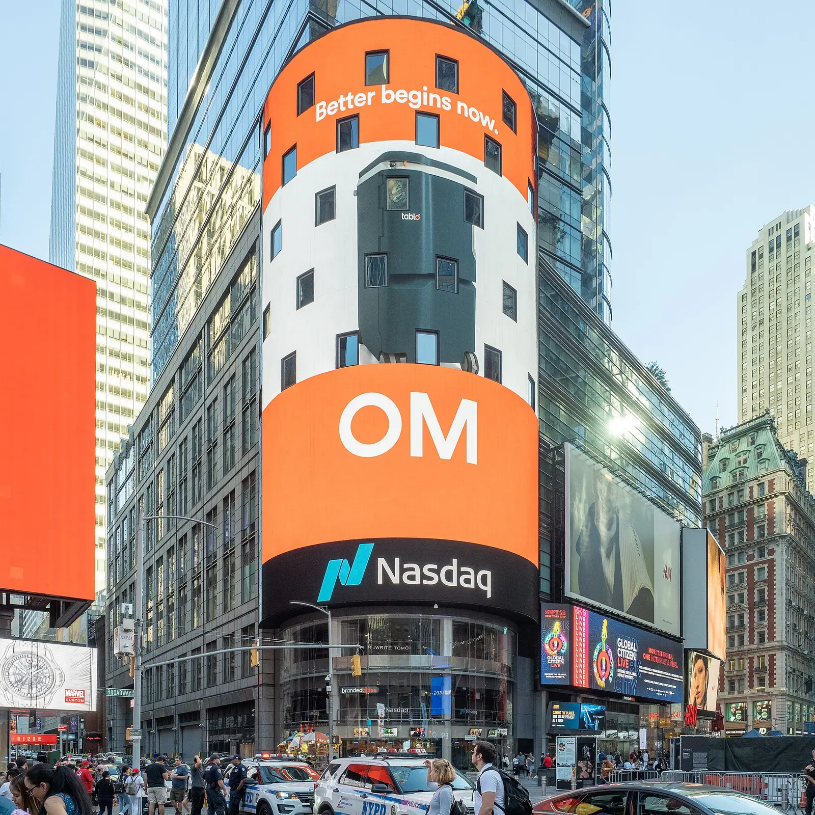The Nasdaq MarketSite tower in Times Square, New York, its curved screen wrapped above the Nasdaq logo at street level