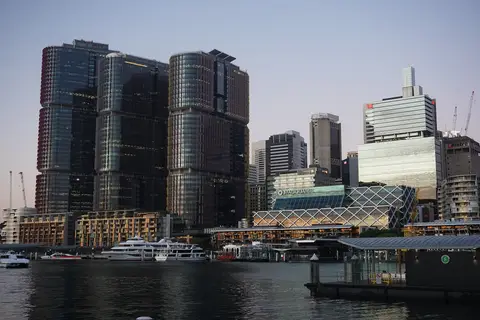 The three International Towers at Barangaroo on the Sydney waterfront at dusk, seen across the harbour