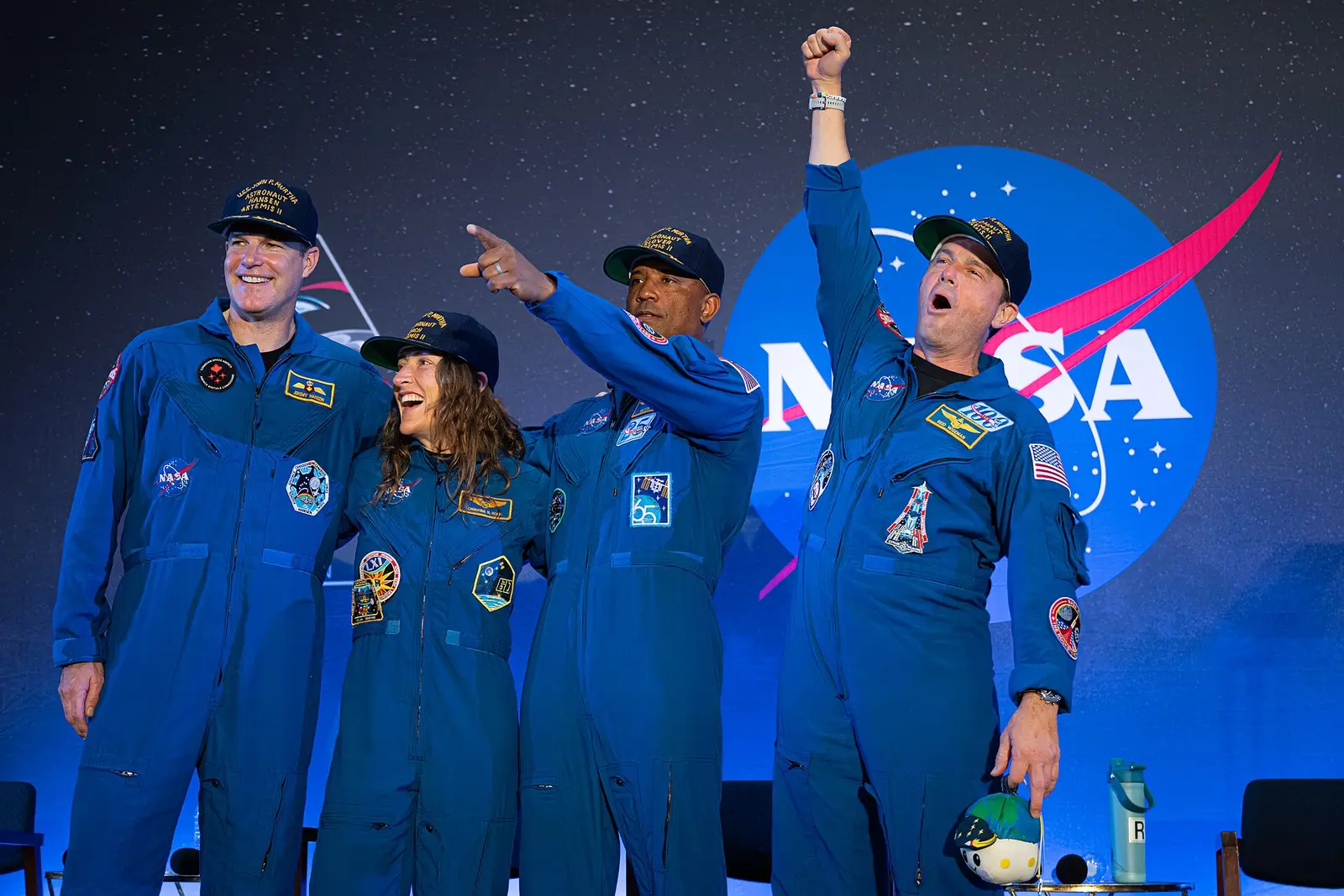 The four Artemis II astronauts - Jeremy Hansen, Christina Koch, Victor Glover and Reid Wiseman - on stage at their crew return event in Houston on 11 April 2026